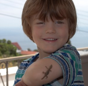 Charlie finds one of the numerous Gecko's outside and occasionally inside our house. We love them