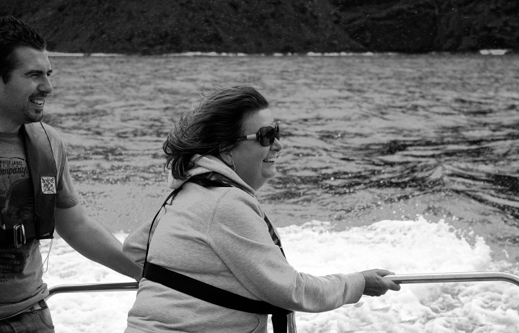 Looking every bit the Lady of the Island Christine hangs on for dear life!