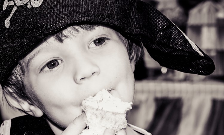 A cup cake helps to break Charlie's mood even if just for a moment.