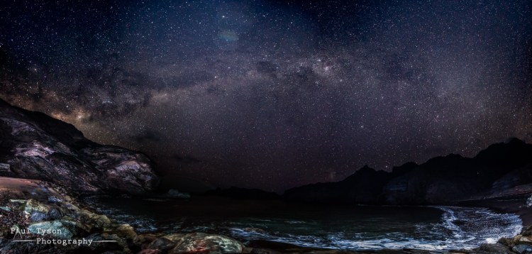 This complicated photo involved a lot of work and is by no means perfect. The foreground requires a lot of light to be cast on it, so during a 20 second exposure, two off camera flashes are fired twice each to through some light on the foreground and distant rocks. Second exposures are then used to captre the skies. Finally a third set of images were needed to get the very nearby rocks in foucs against the distant stars. All in, 22 photos are then layered and stitched into this large panorama. 